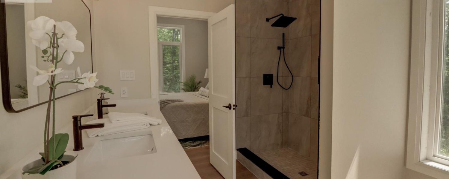 primary suite bathroom looking bedroom